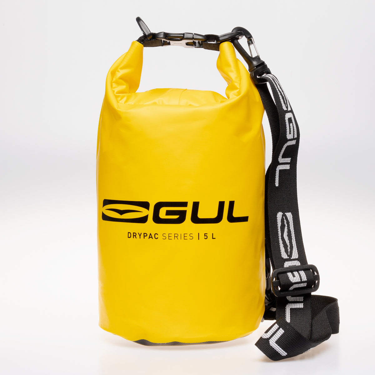 Front view of the yellow GUL Drypac 5L dry bag with black shoulder strap and buckle closure.
