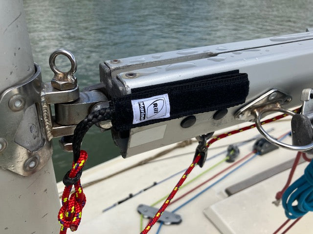 Velcro pull handle keeping rope accessible and organized on sailboat
