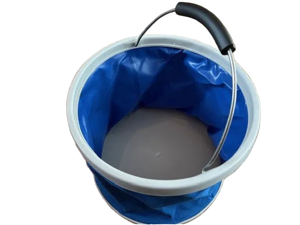Angled view into the open blue folding bucket, showing its grey base and raised handle with black grip.