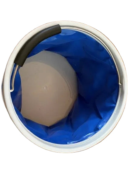 Top view inside the blue folding bucket, showing its grey base and metal handle resting along the rim.