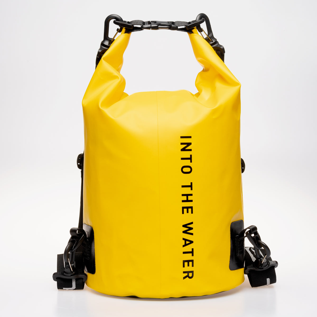 Rear view of the yellow GUL Drypac 10L dry bag showing strap clips and ‘Into the Water’ lettering.