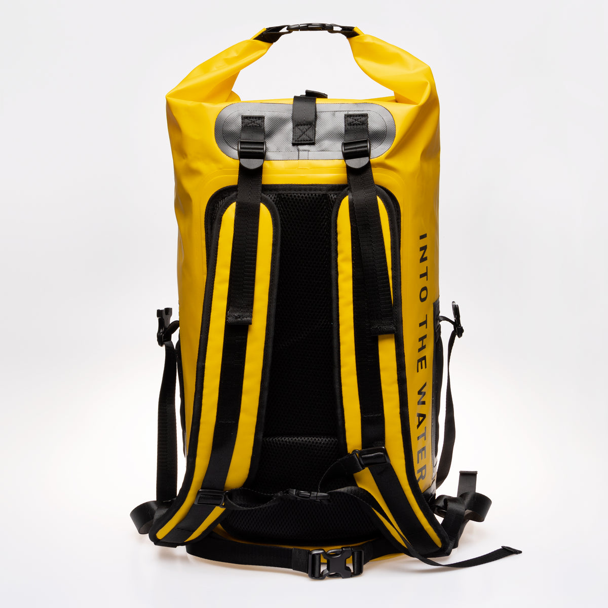 Rear view of the yellow GUL Drypac 40L dry bag showing backpack straps and padded back panel.