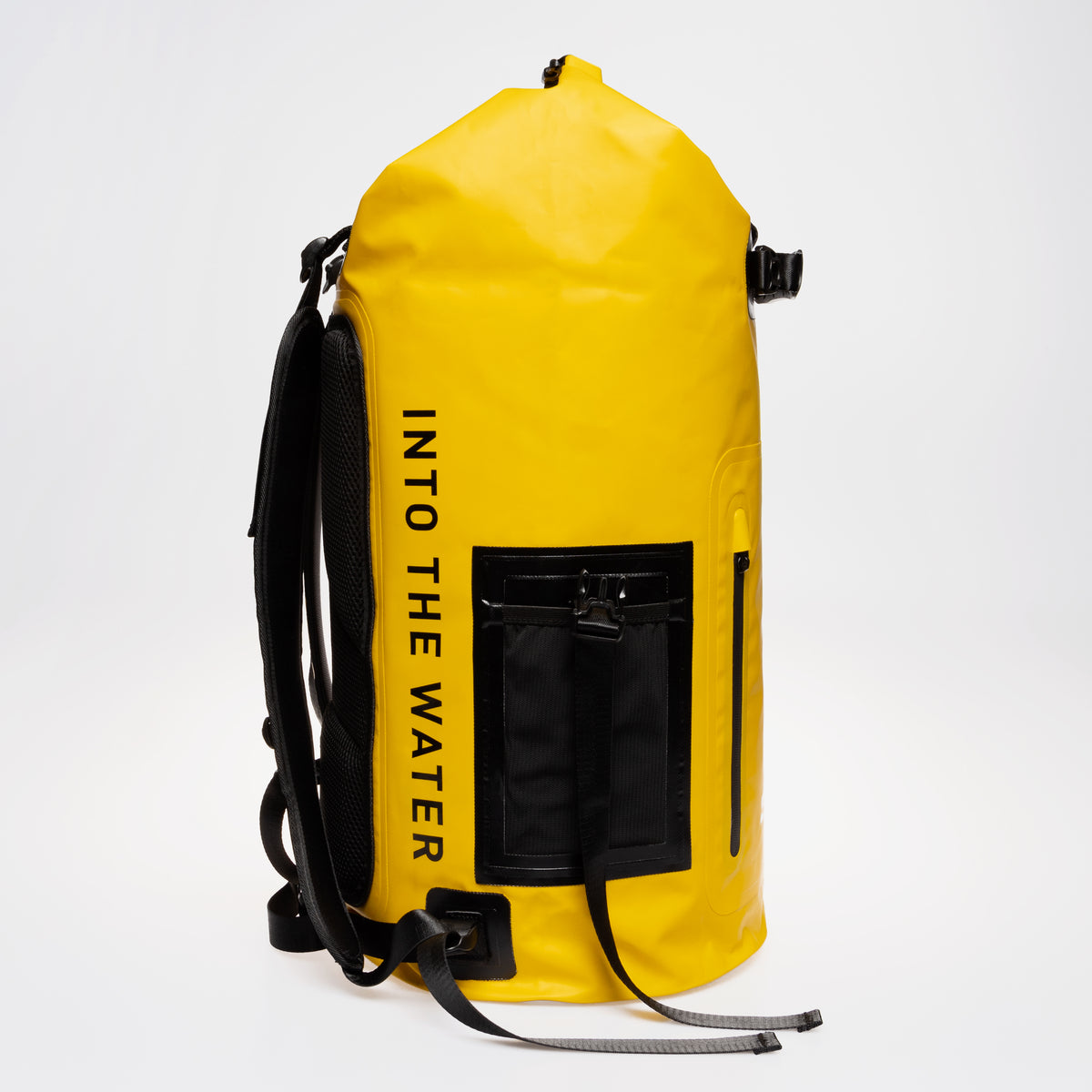 Side view of the yellow GUL Drypac 40L dry bag showing a carry handle and backpack straps.