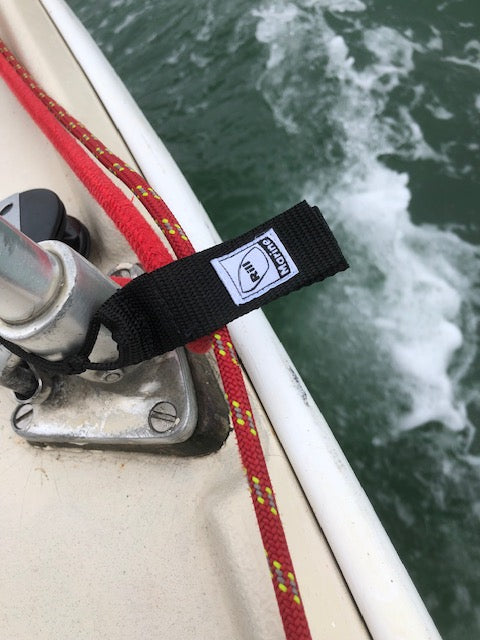 Marine halyard keeper with Velcro strap in use on sailboat
