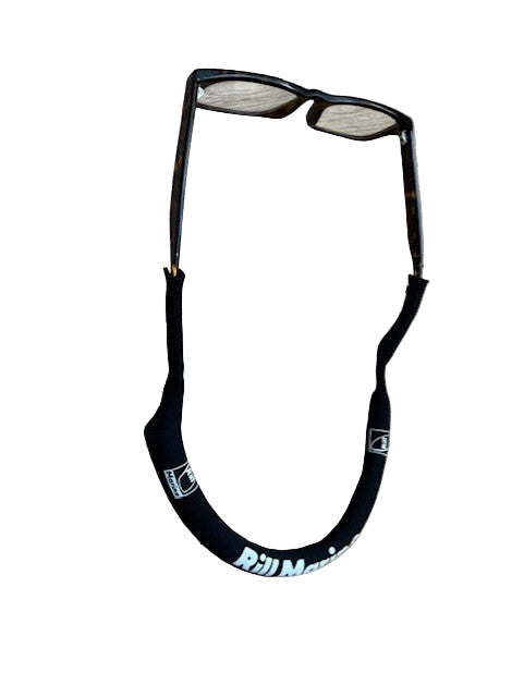 Black floating glasses strap attached to sunglasses worn around neck