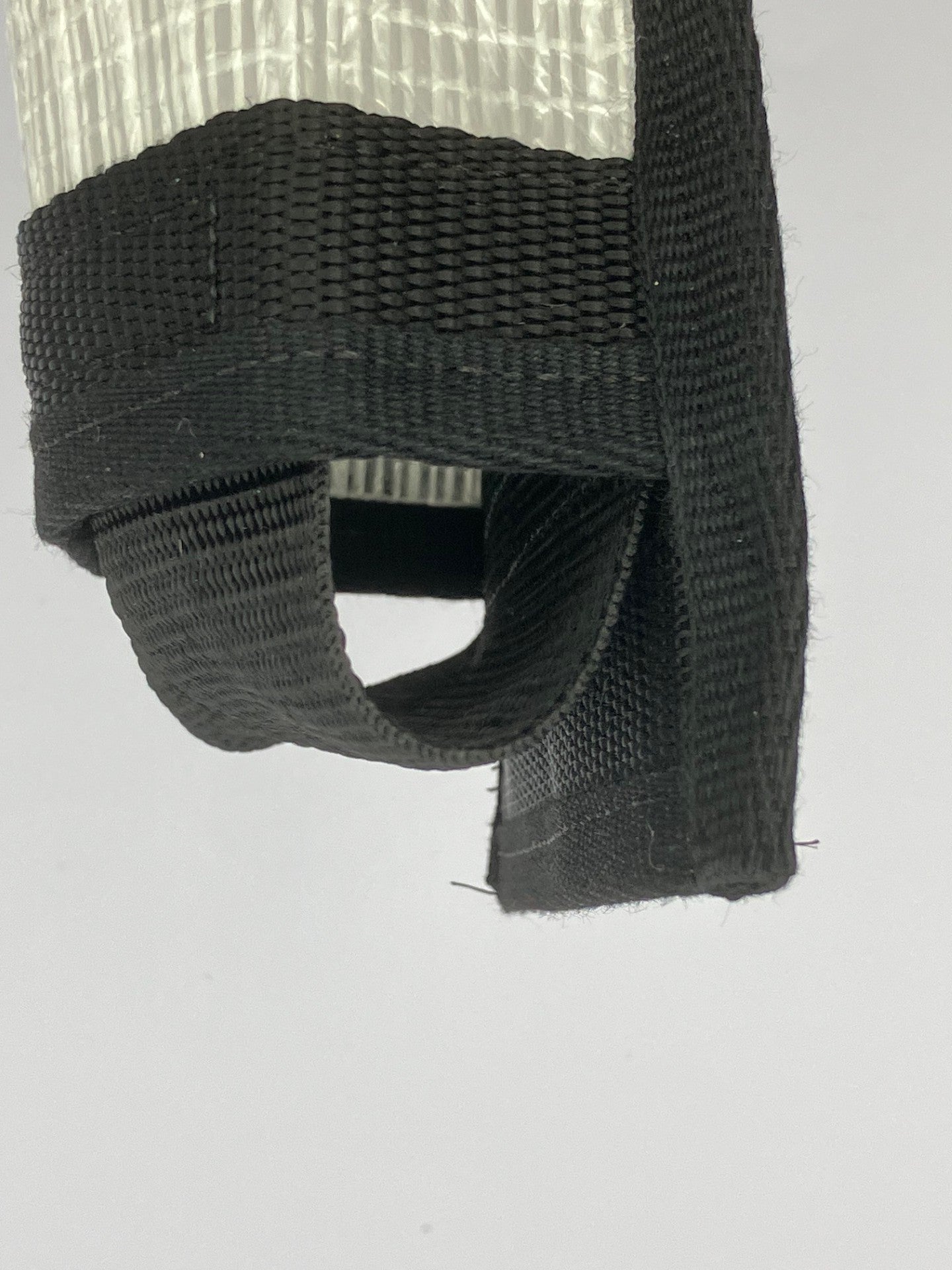 Close-up detail of sustainable bottle holder made from recycled sailing material