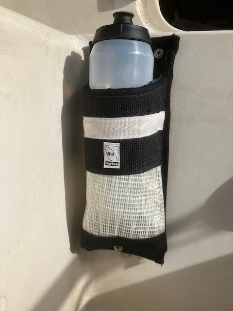 Recycled sail bottle holder holding sports drink bottle