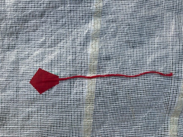 Tell tales on sail demonstrating proper sail trim while sailing