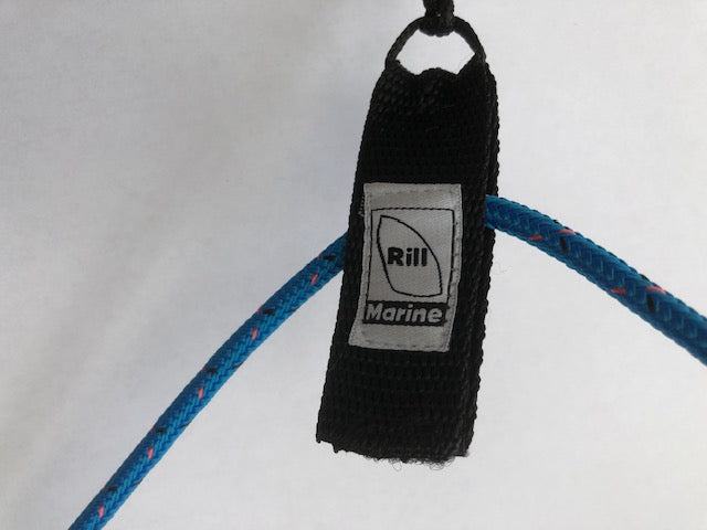 Close-up of Velcro halyard keeper showing hook and loop fastening system